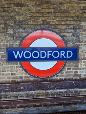 Sign at train station in Woodford England